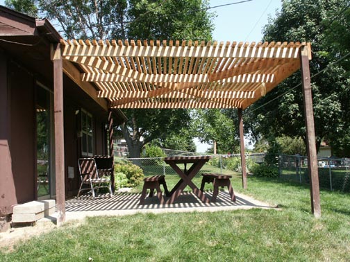 Cedar Pergola is Decay resistant, waiting to dry out prior to staining